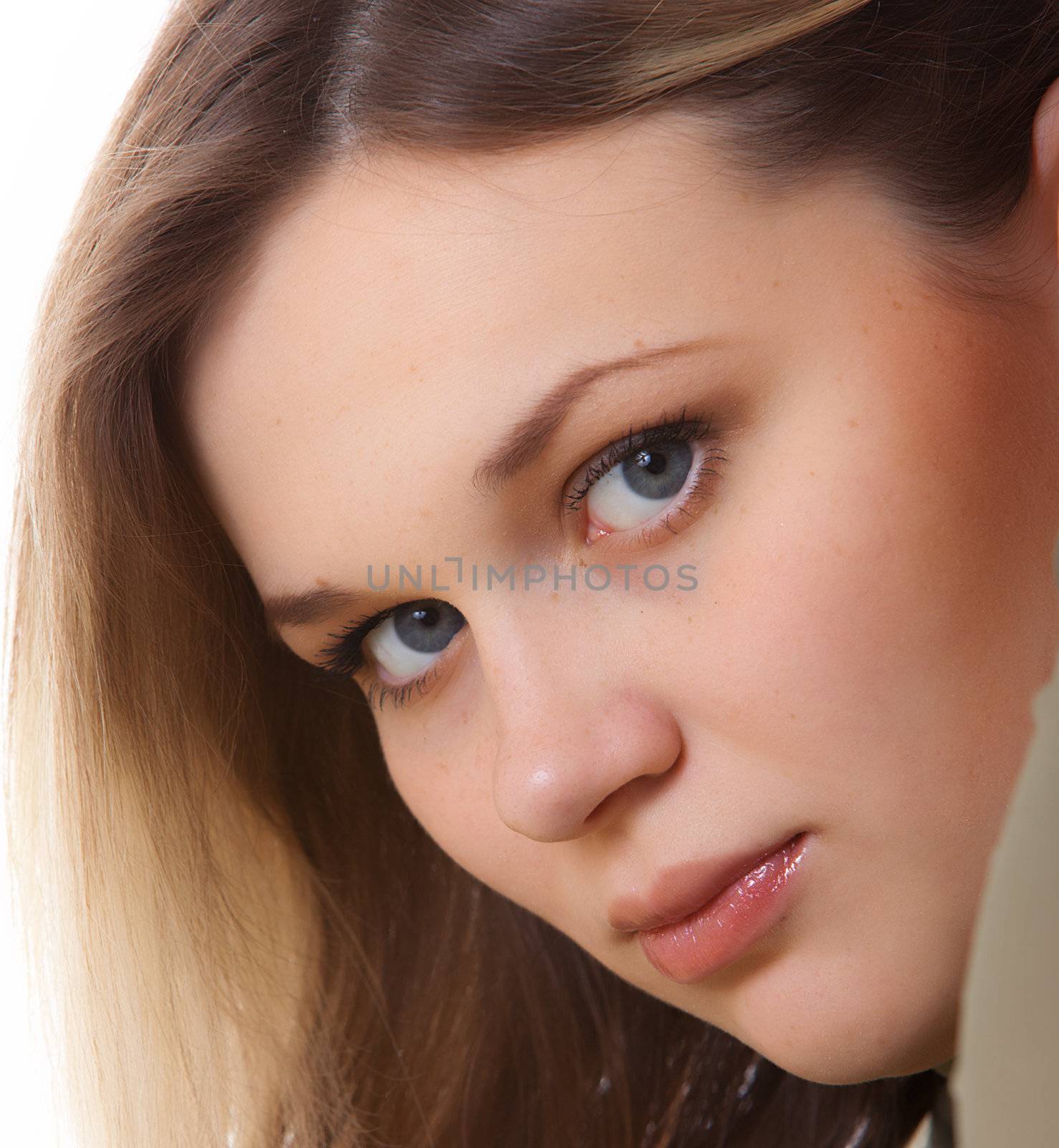 Portrait of the young beautiful girl on a white background.