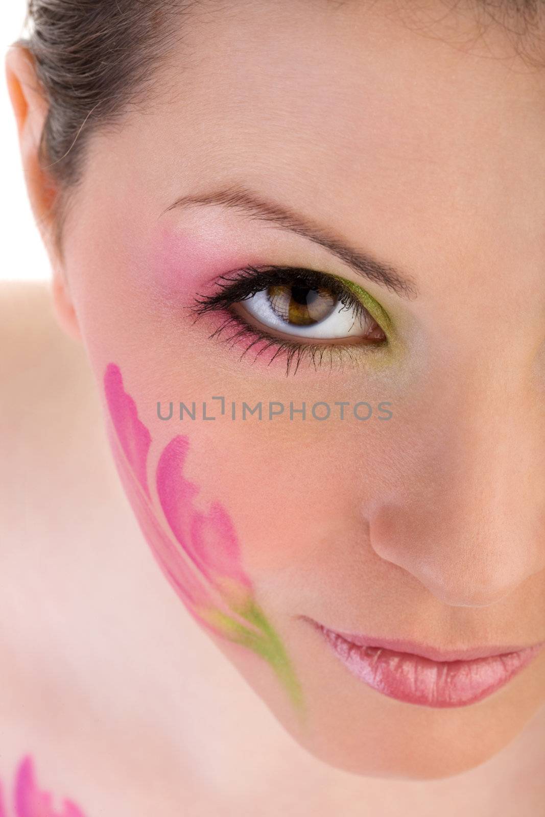 Closeup photo of woman face with painting