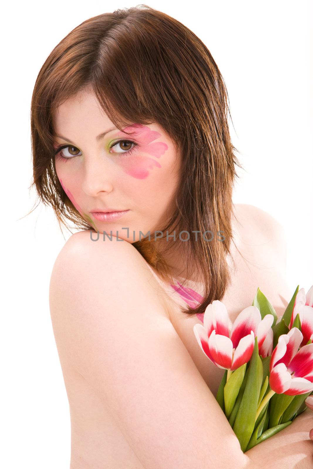 Young woman holding bouquet of tulips by mihhailov