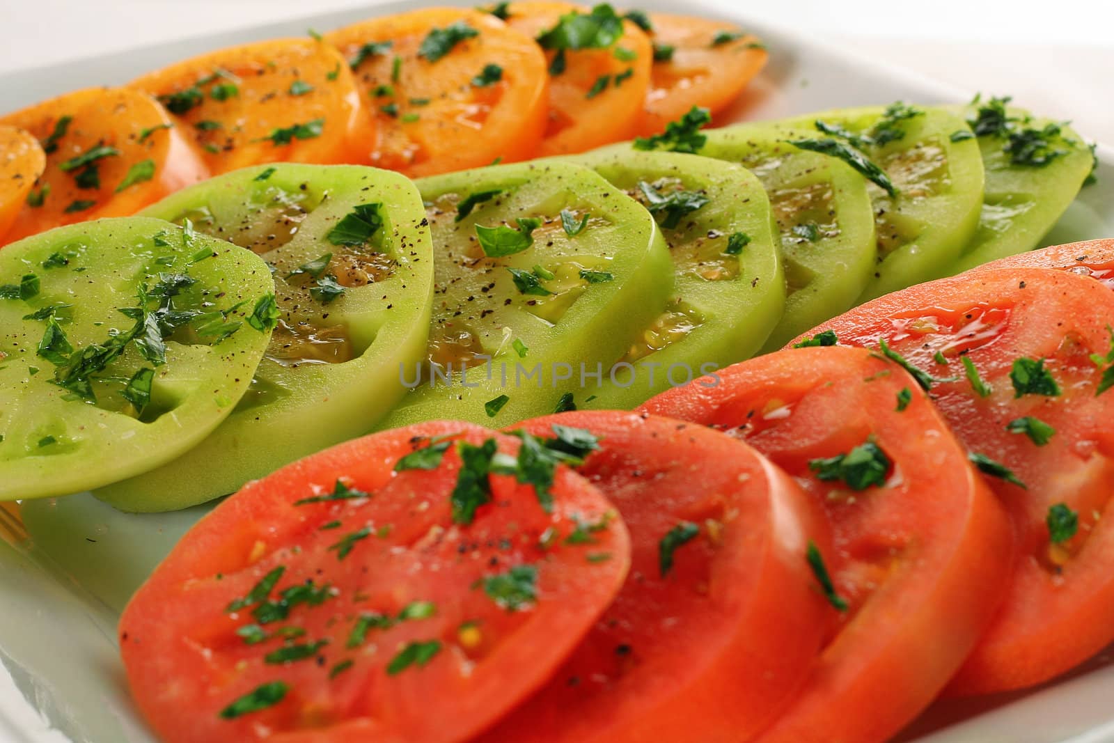 shot of yellow green & red tomatoes copy by creativestock