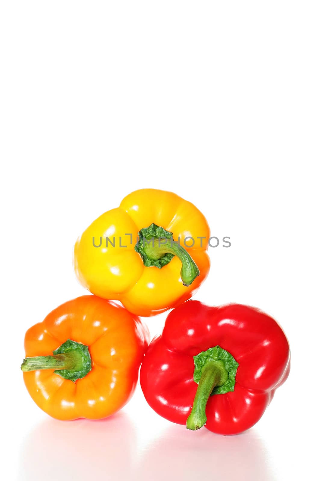 shot of triple stacked peppers by creativestock