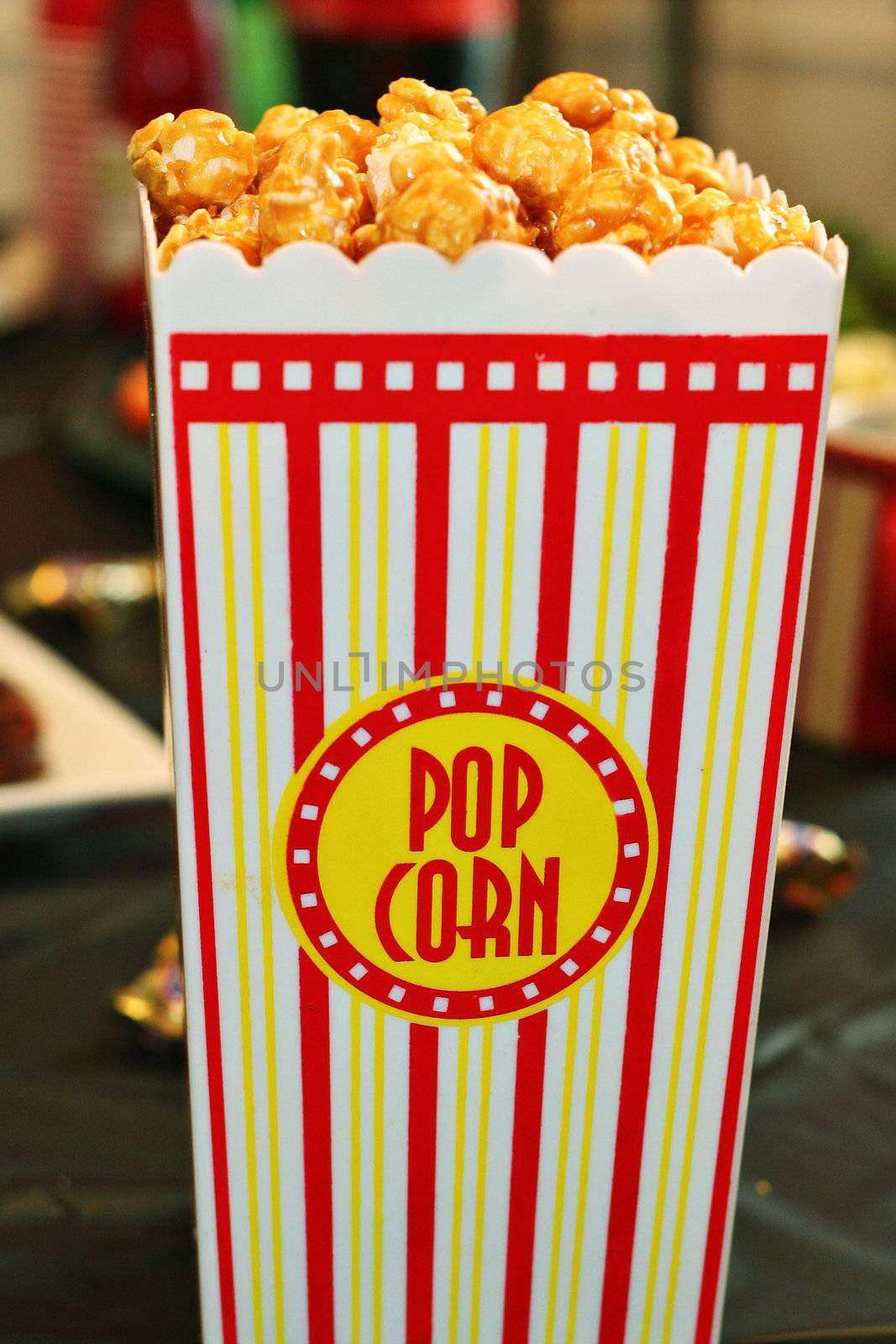 shot of yummy caramel popcorn by creativestock
