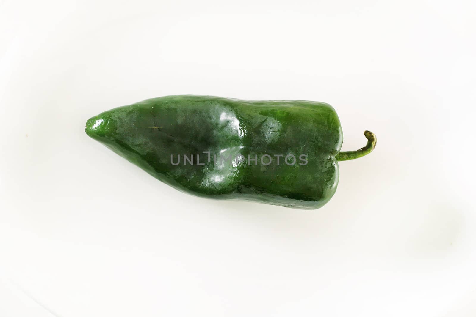 shot of a poblano pepper overhead by creativestock