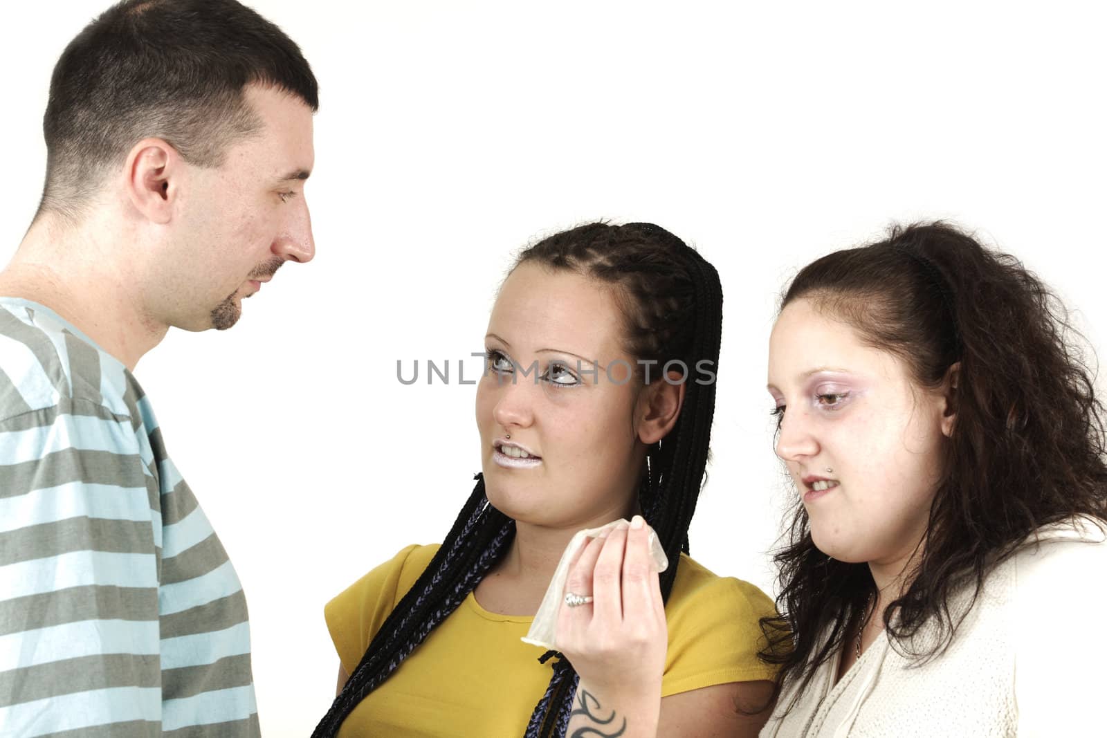 Three young people discuss about found condom