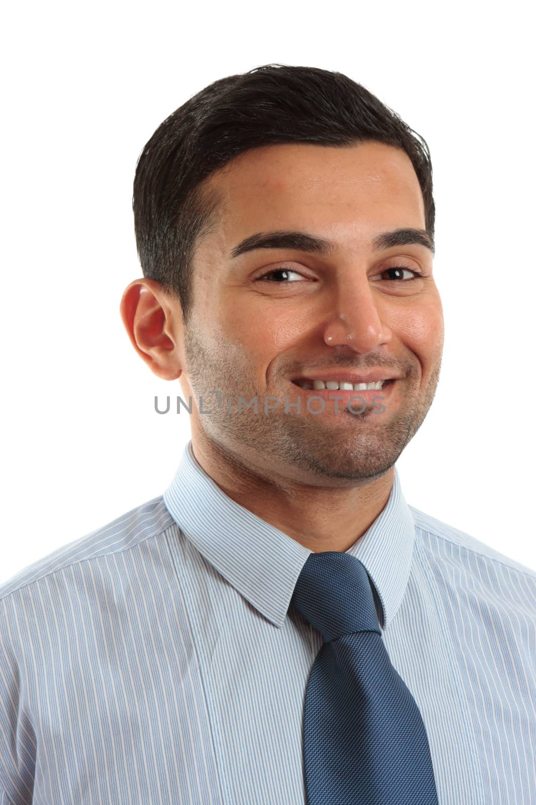 Smiling businessman wearing a blue pinstripe shirt and blue tie.  White background.