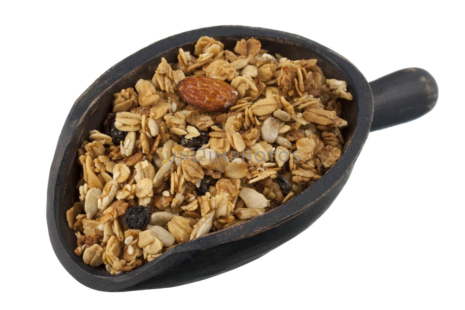natural granola with raisins, sunflower seeds, almonds and other nuts on a rustic, wooden scoop, isolated on white
