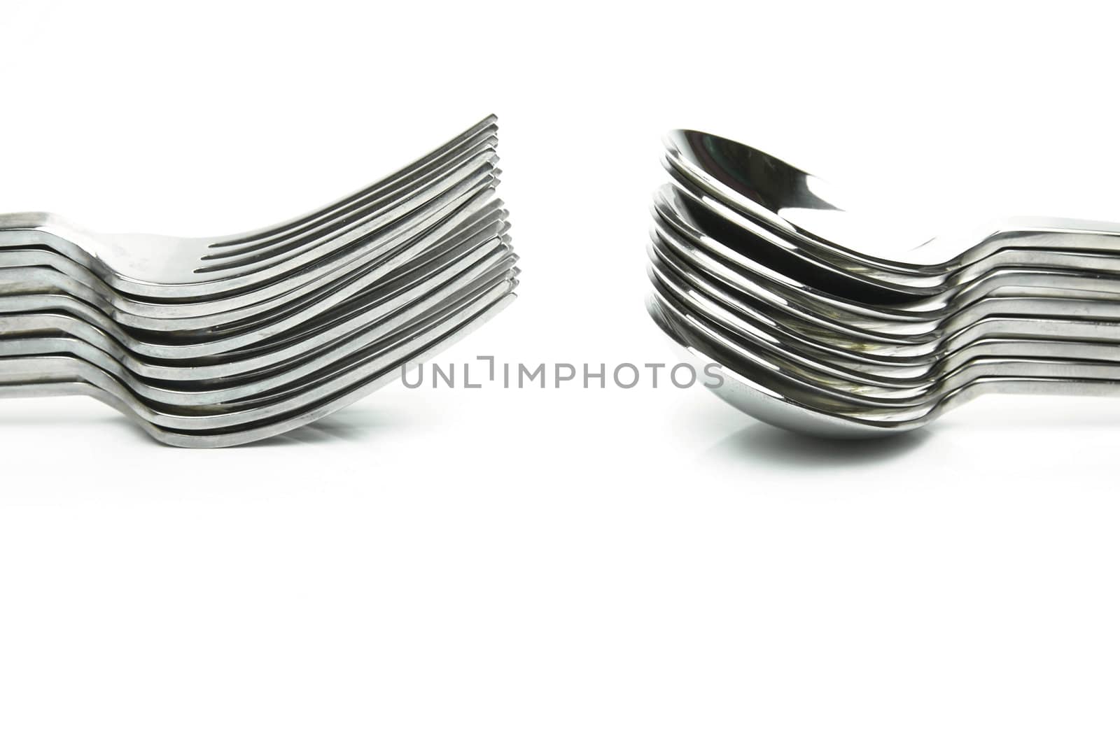 Forks and spoons isolated against a white background