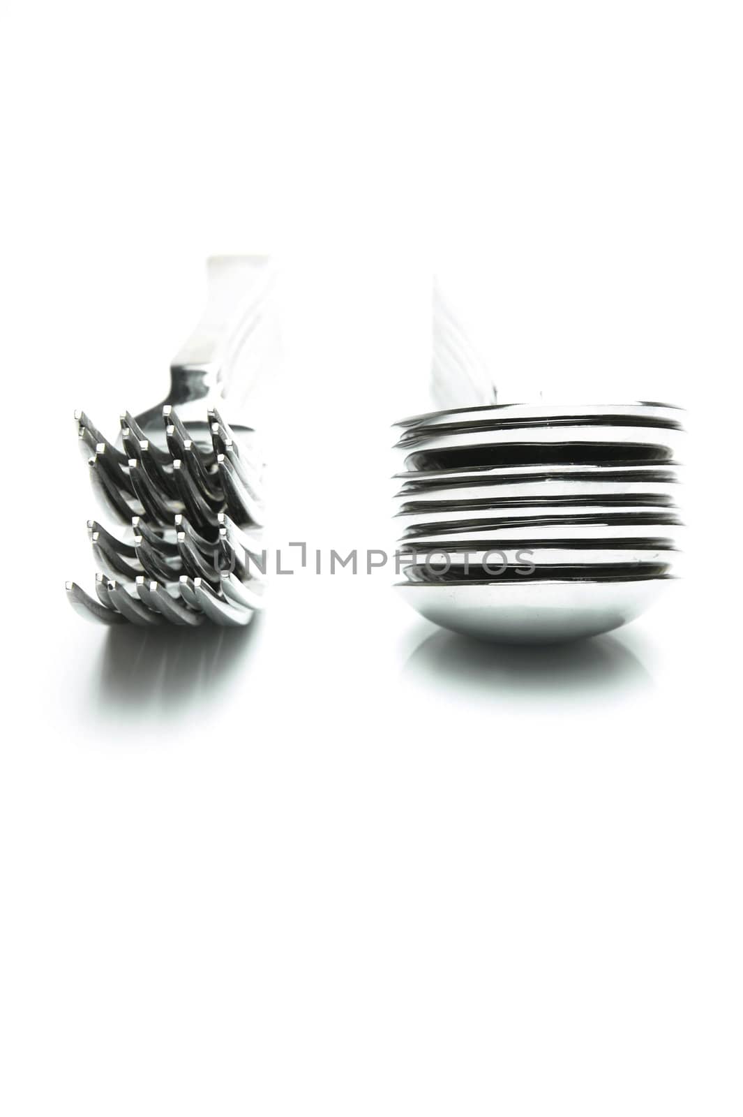 Forks and spoons isolated against a white background