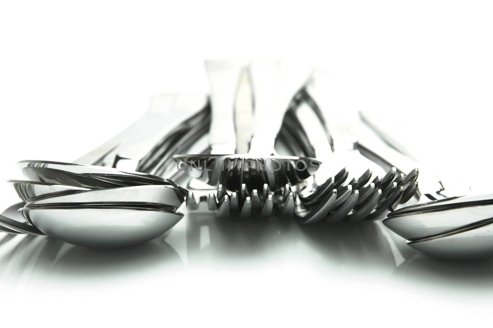 Forks and spoons isolated against a white background