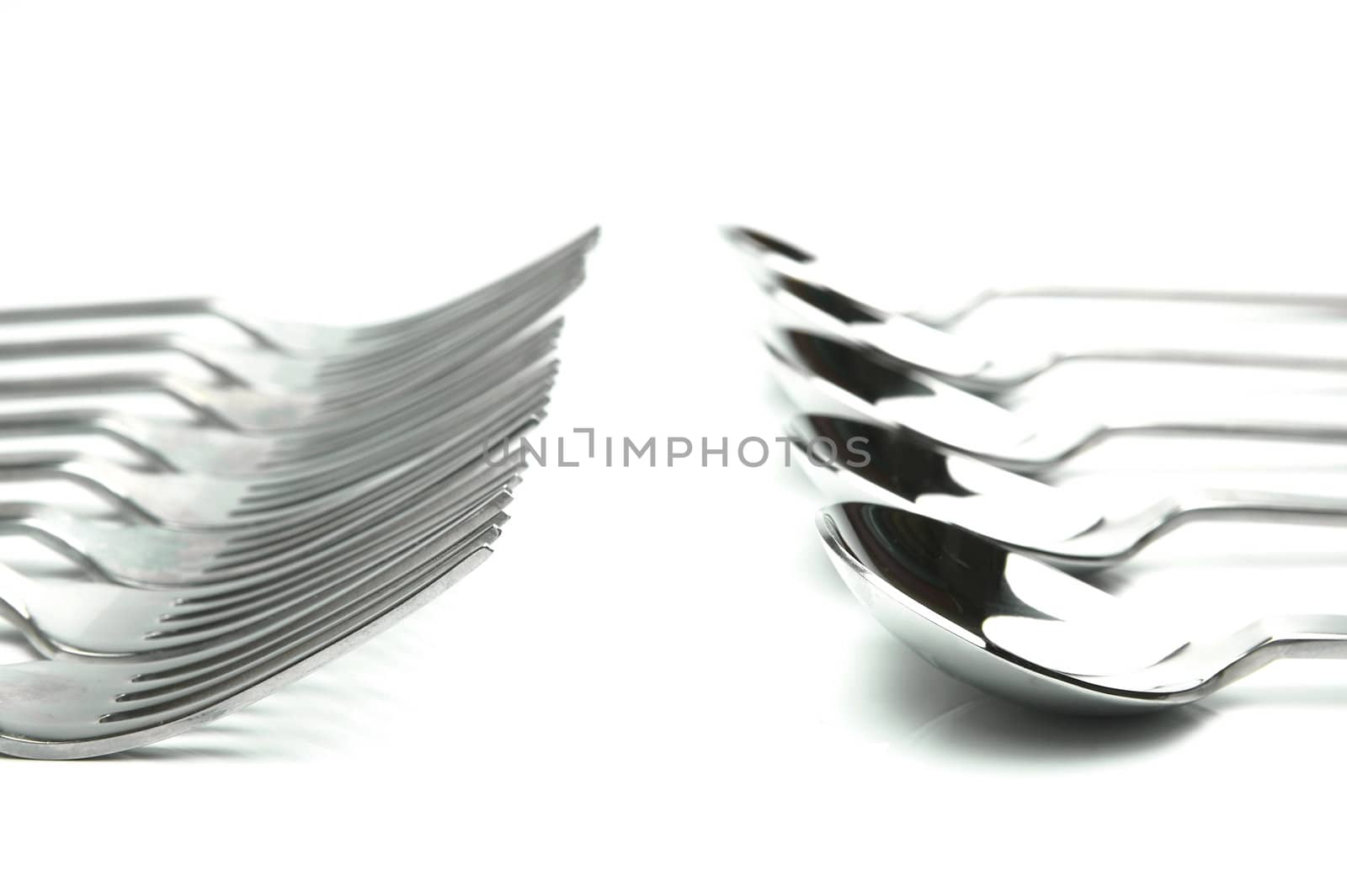 Forks and spoons isolated against a white background