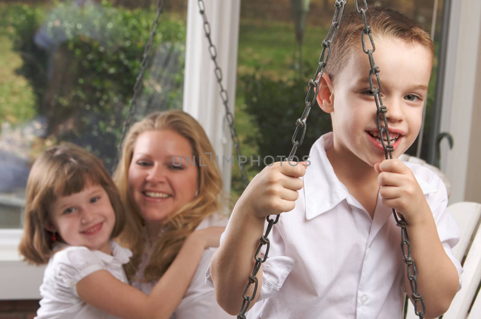 Young Boy Poses with Mom and Sister by Feverpitched