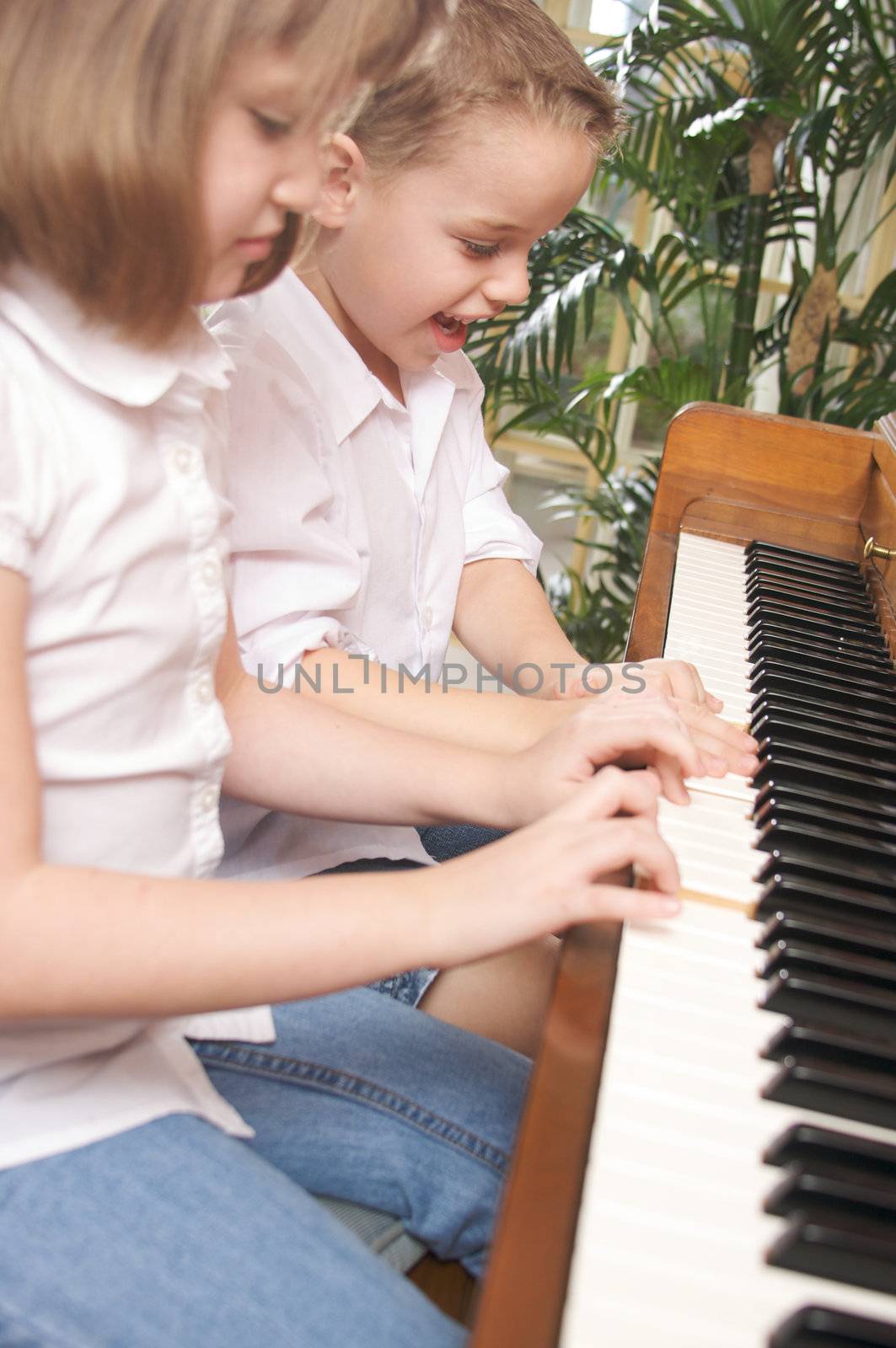 Children Playing the Piano by Feverpitched