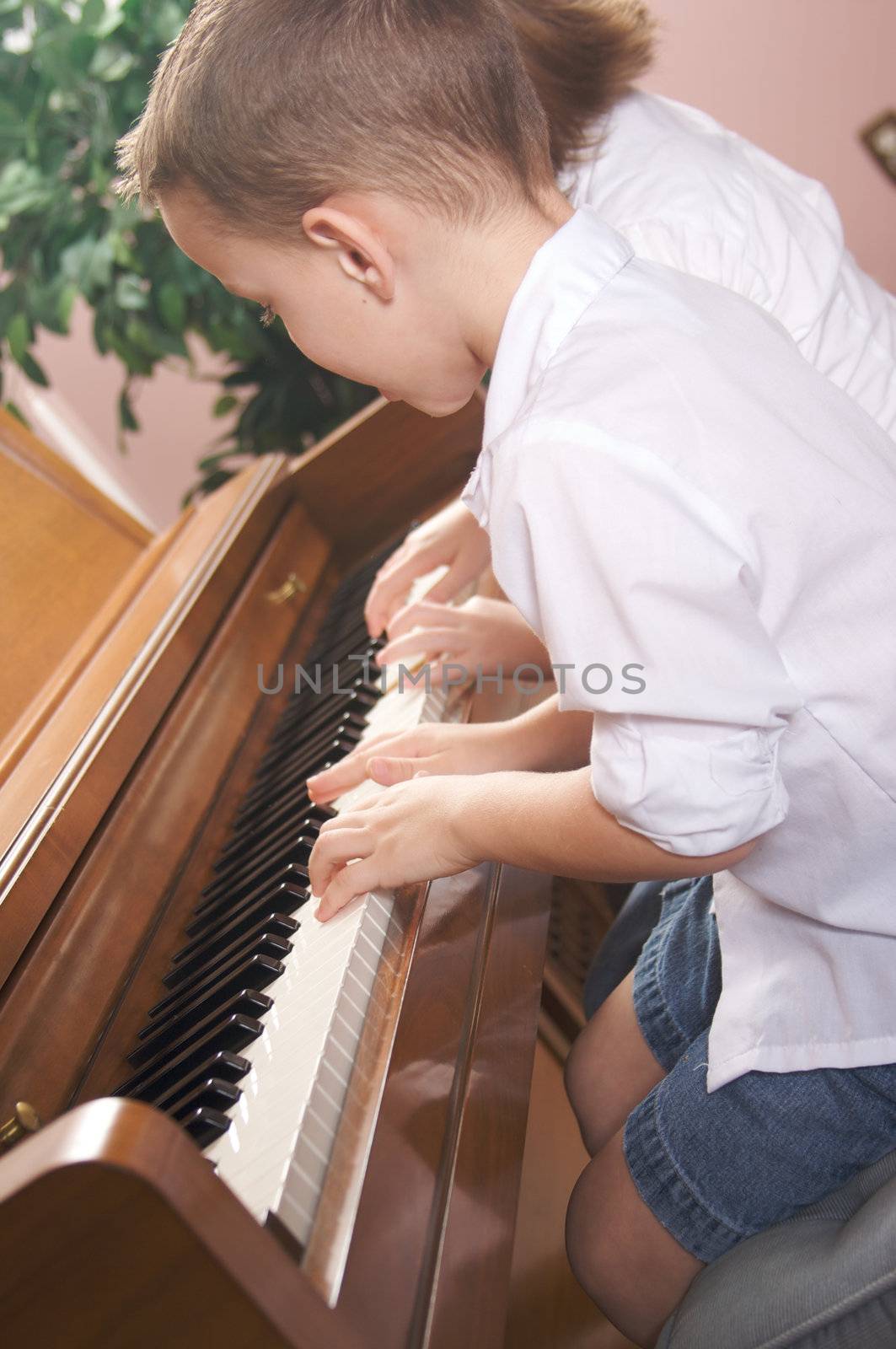 Children Playing the Piano by Feverpitched