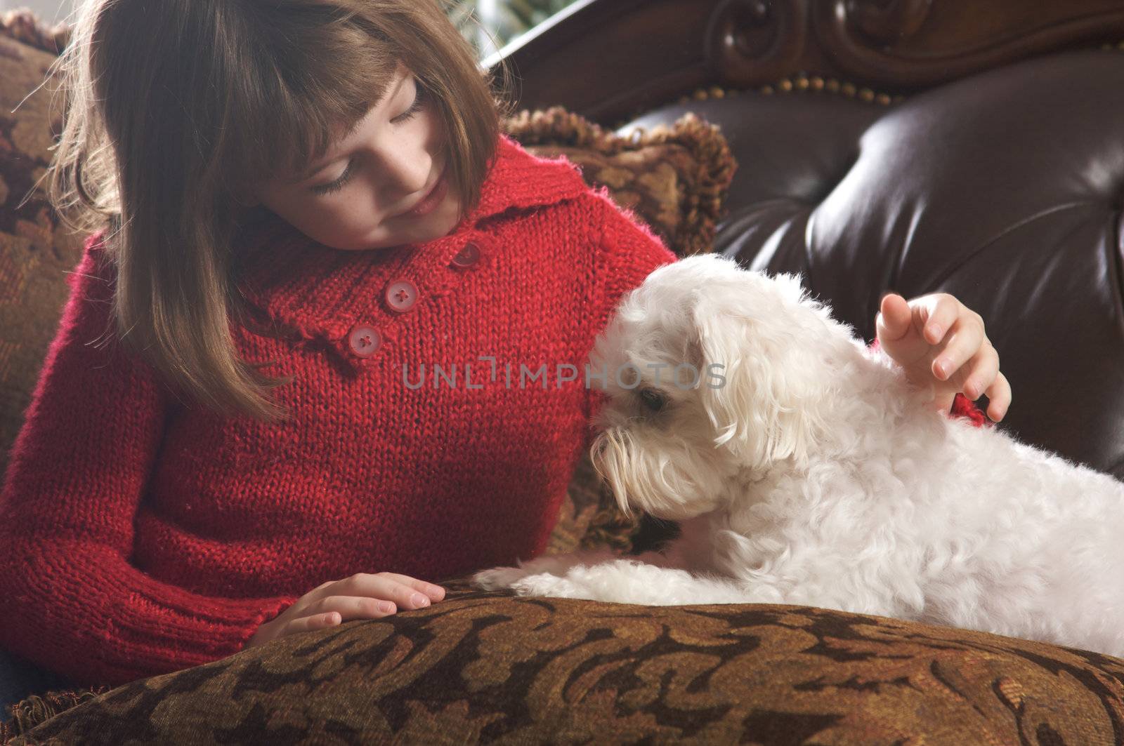 Young Girls Poses with Her Maltese Puppy