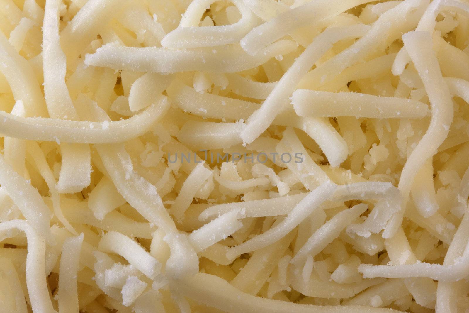 soft low fat shredded mozarella cheese background