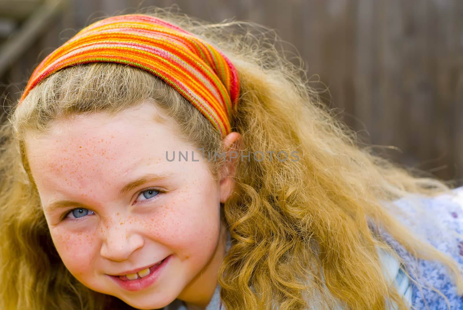 girl smiling into camera by rongreer