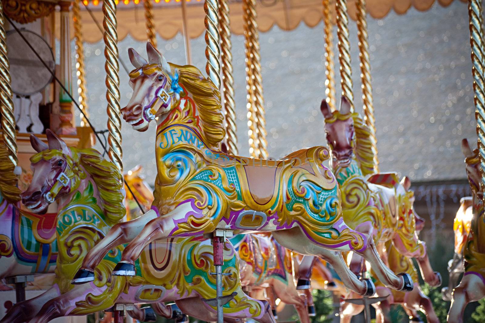 Colorful wooden horses on a carousel ride