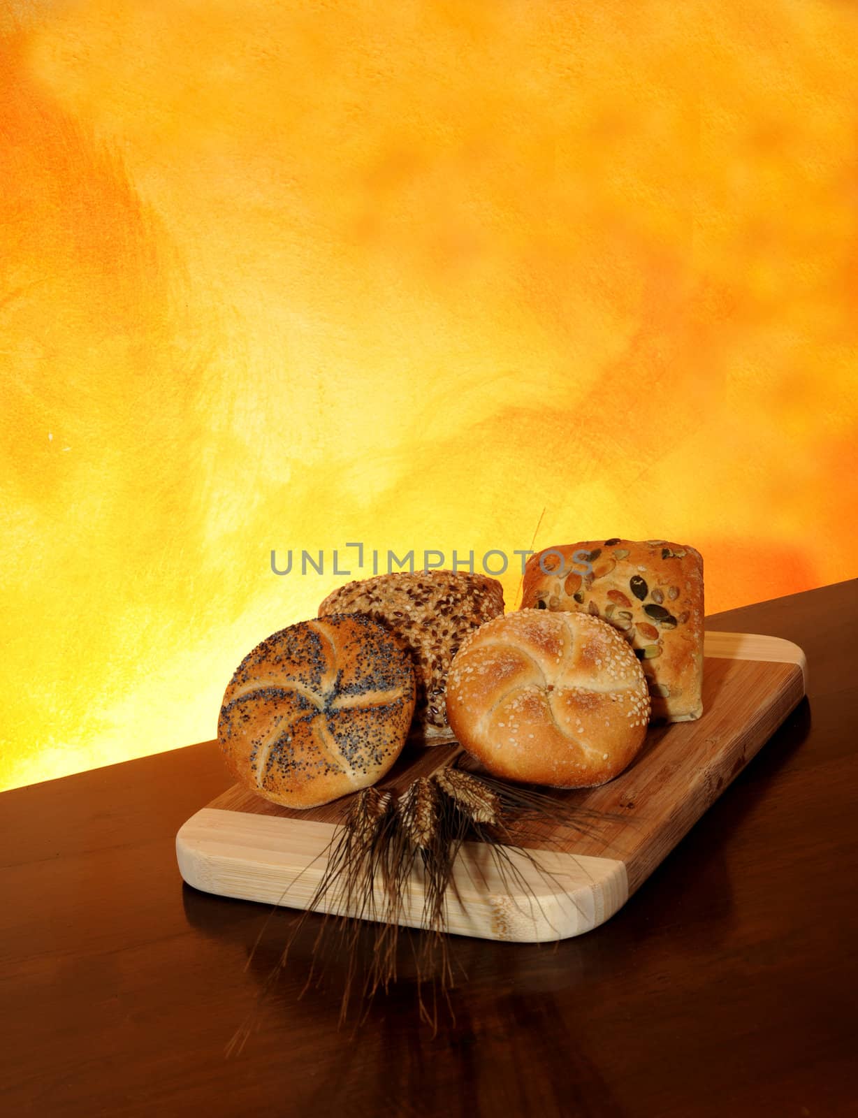 Sandwiches in cereals, wheat ears on the table dark wood