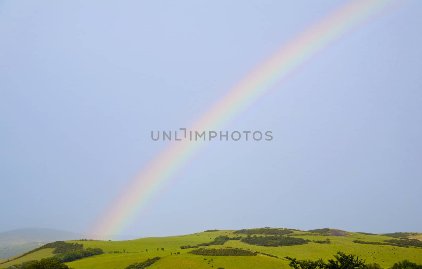 A rainbow over a lovely rural scene