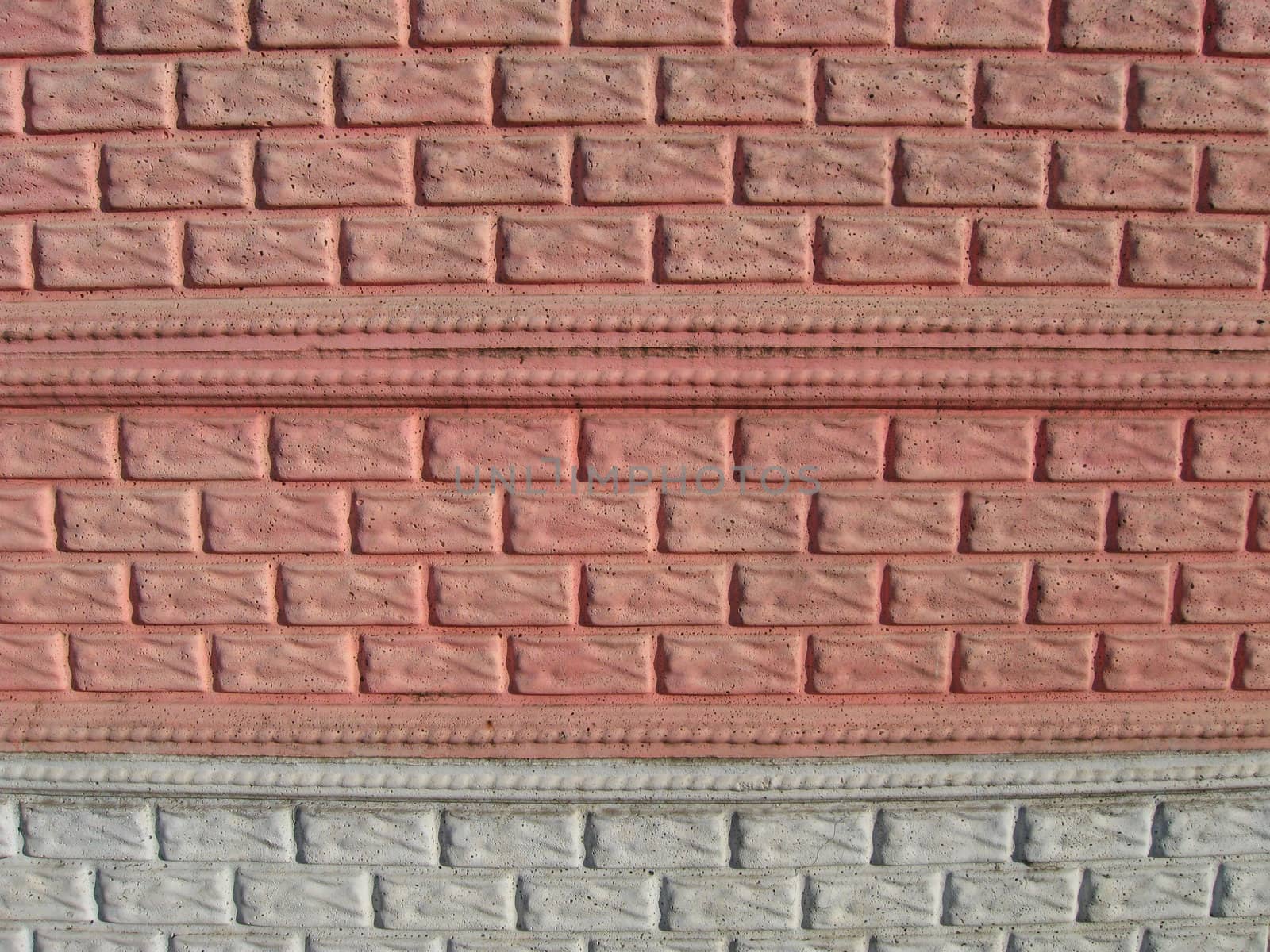 Wall from concrete under a brick, painted in colours.