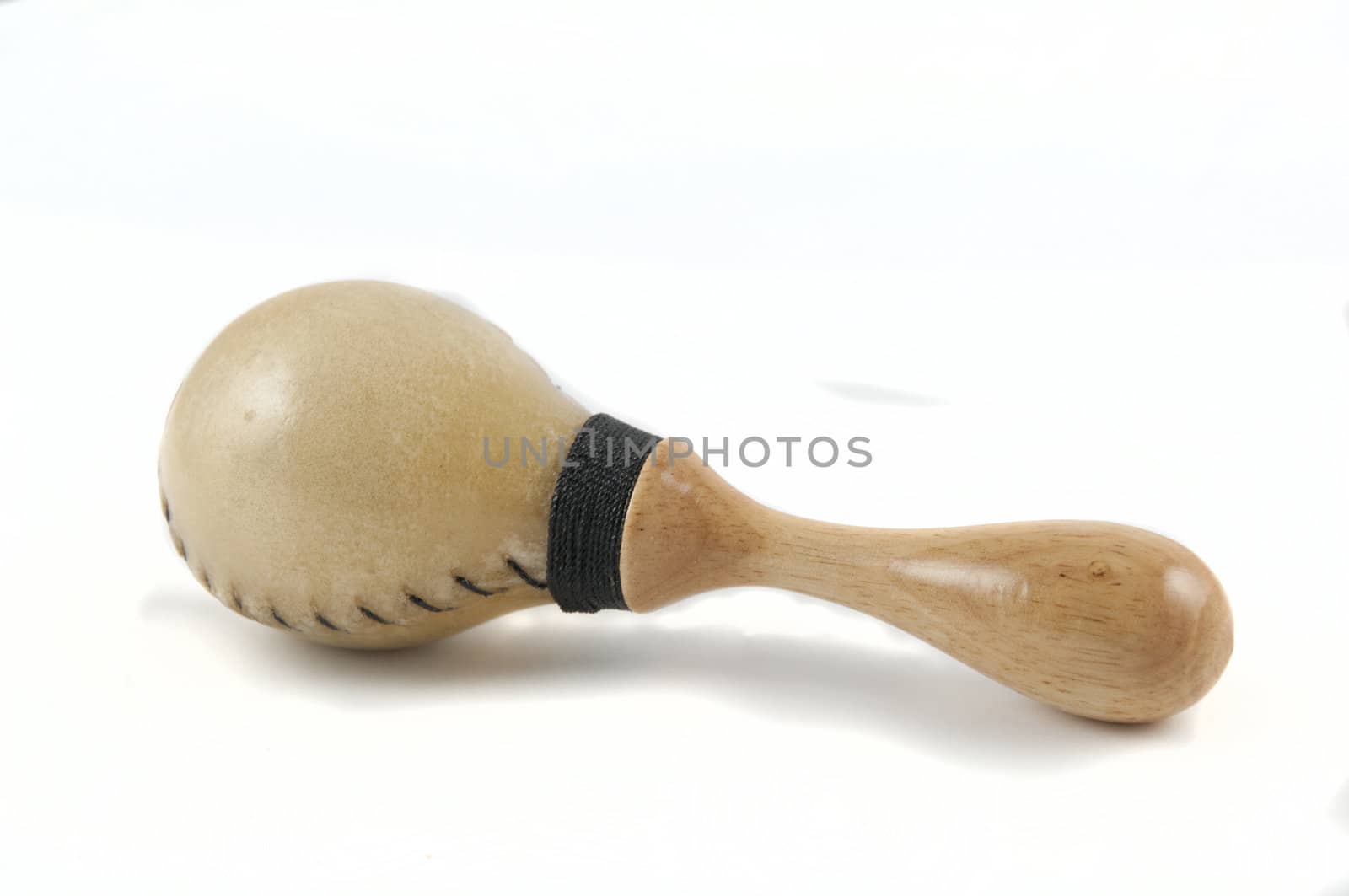 A wooden maraca isolated on white.