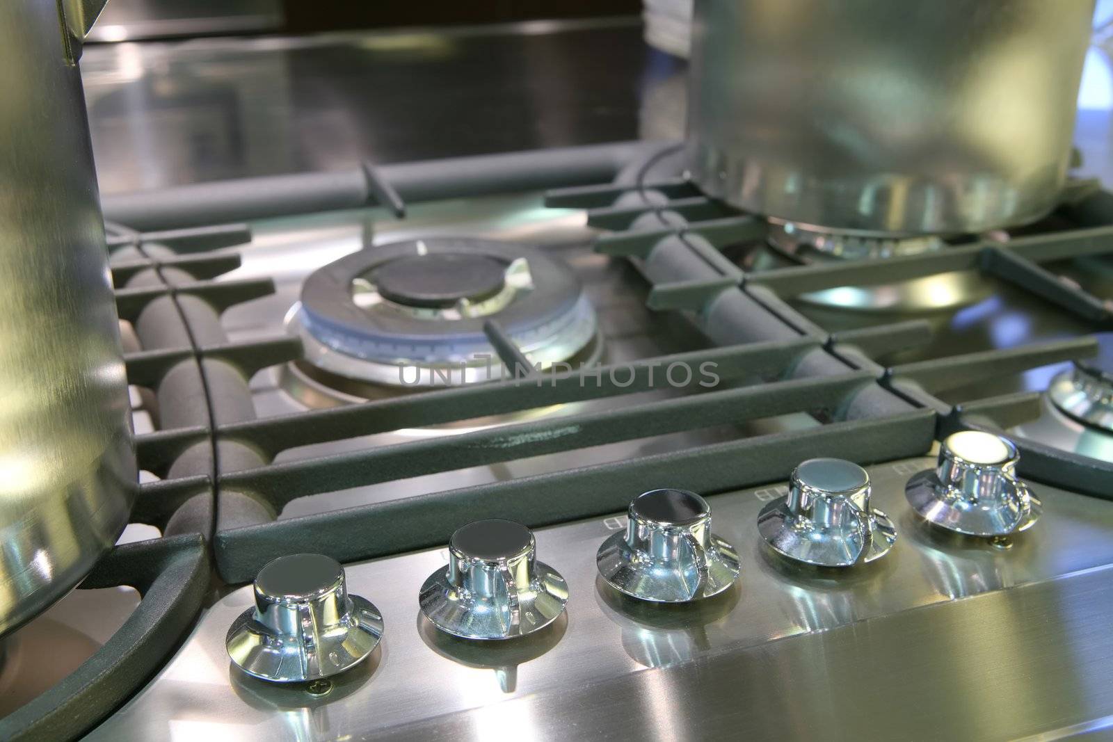 fragment of gas fryer with saucepans from steel