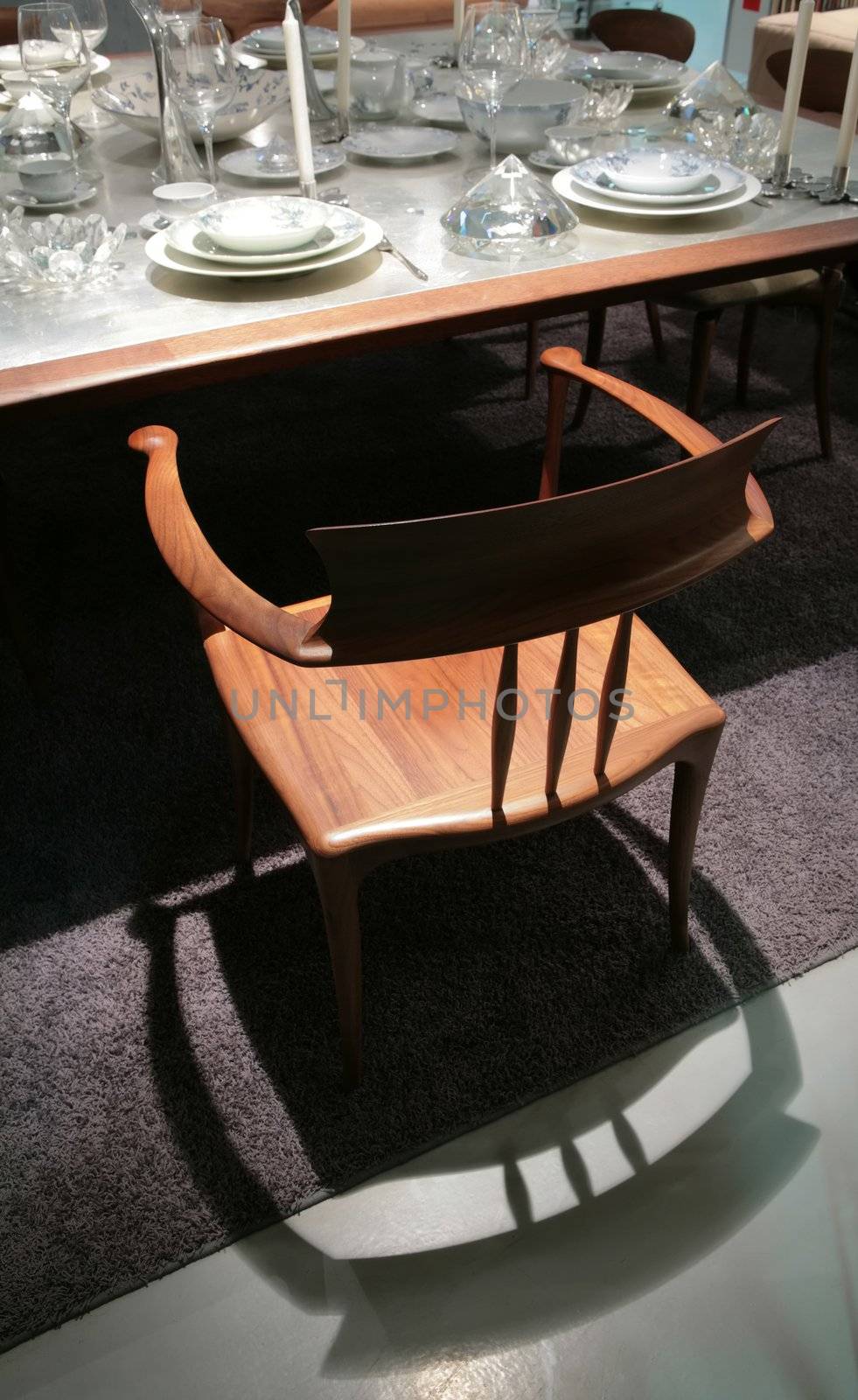 wooden chair and its shade around set table