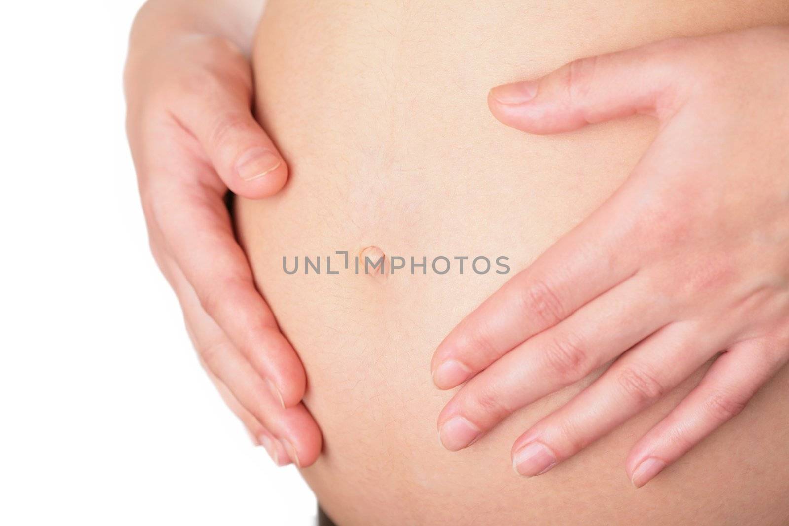close-up, belly and hands of the pregnant woman on white background