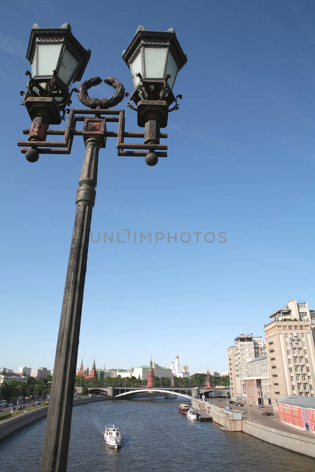 Old-time Moscow Torch on Background Blue Sky, Silhouettes Kremlin