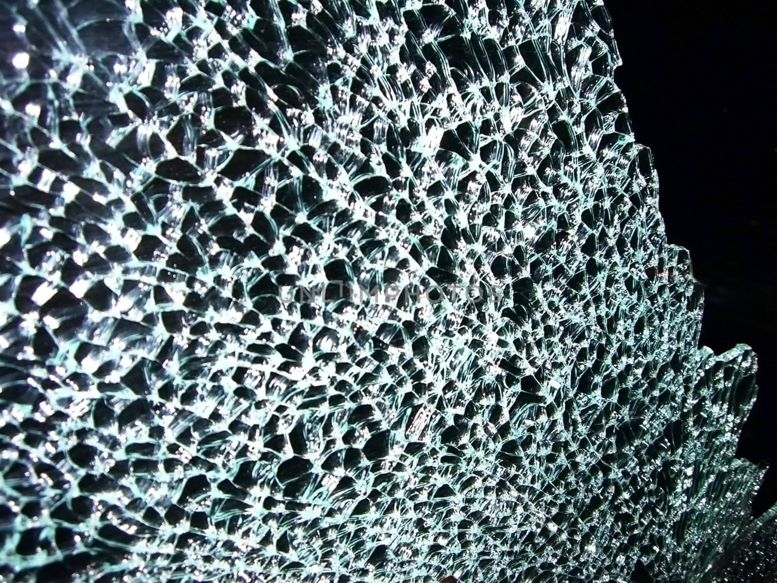 Razbitov glass on machine, beaten mirror, splinter,rift, pattern, background, texture, invoice, abstraction