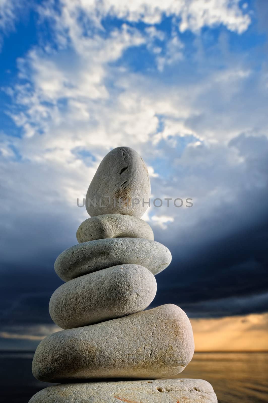 The stack of the pebbles on the background of the dark sky