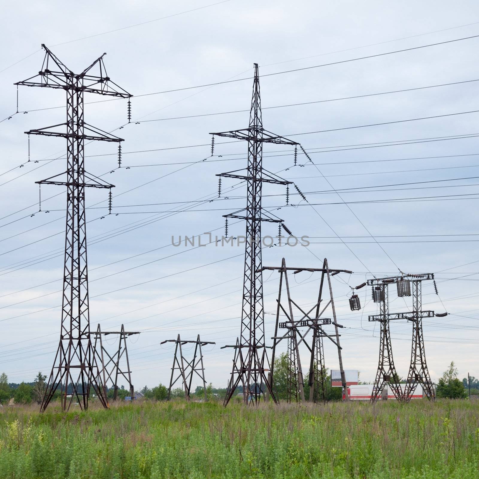 Several high-voltage transmission lines against the sky