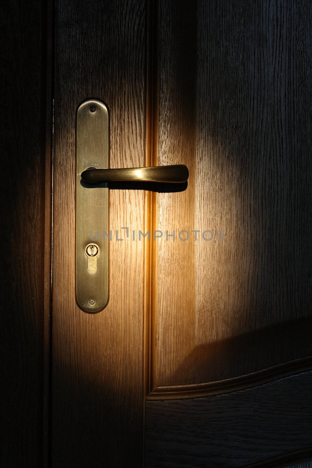 Night scene with wooden door and lock. Closeup