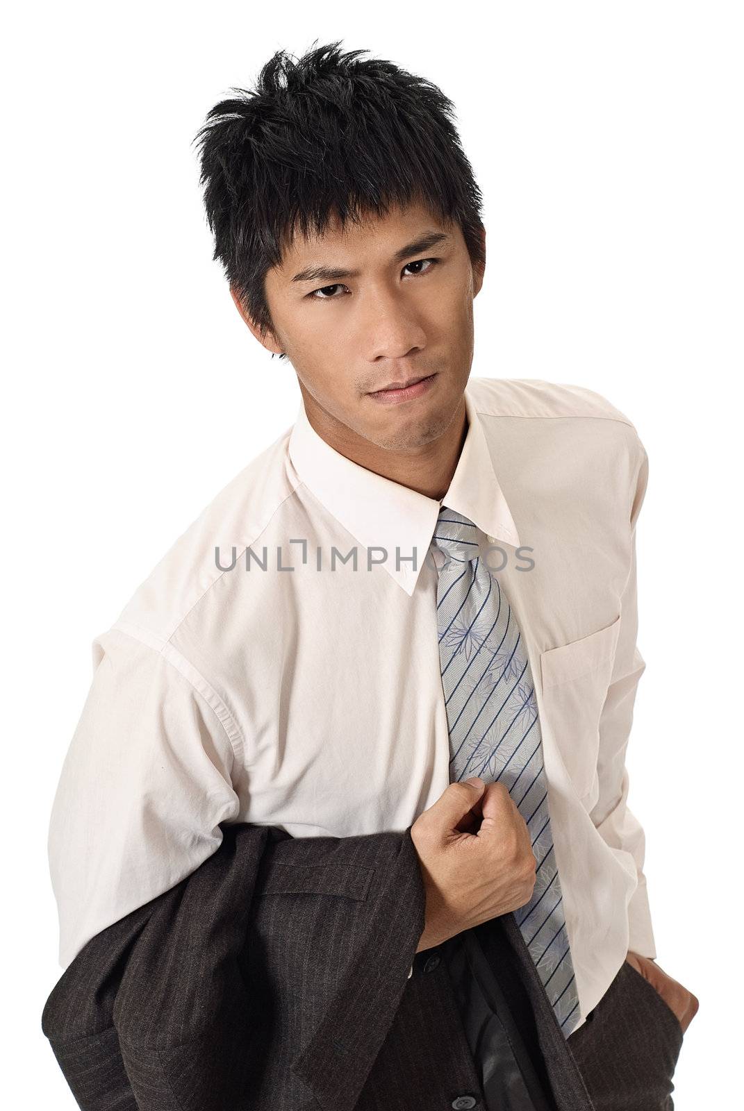 Young businessman holding coat with confident expression on face on white background.