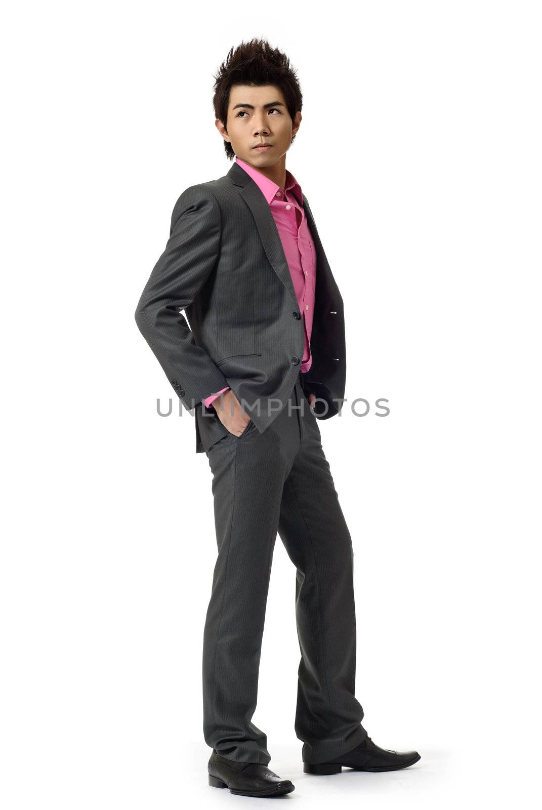 Young businessman look copyspace, full length portrait isolated on white.