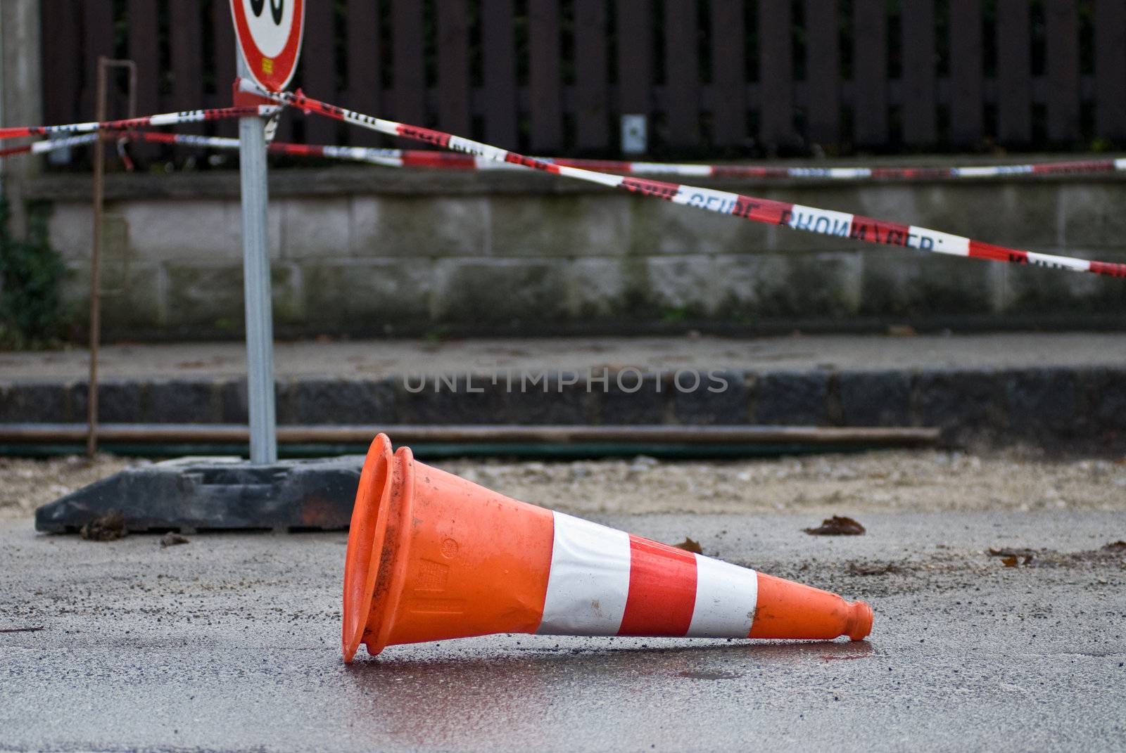 a construction site cap lying horizontal on the road