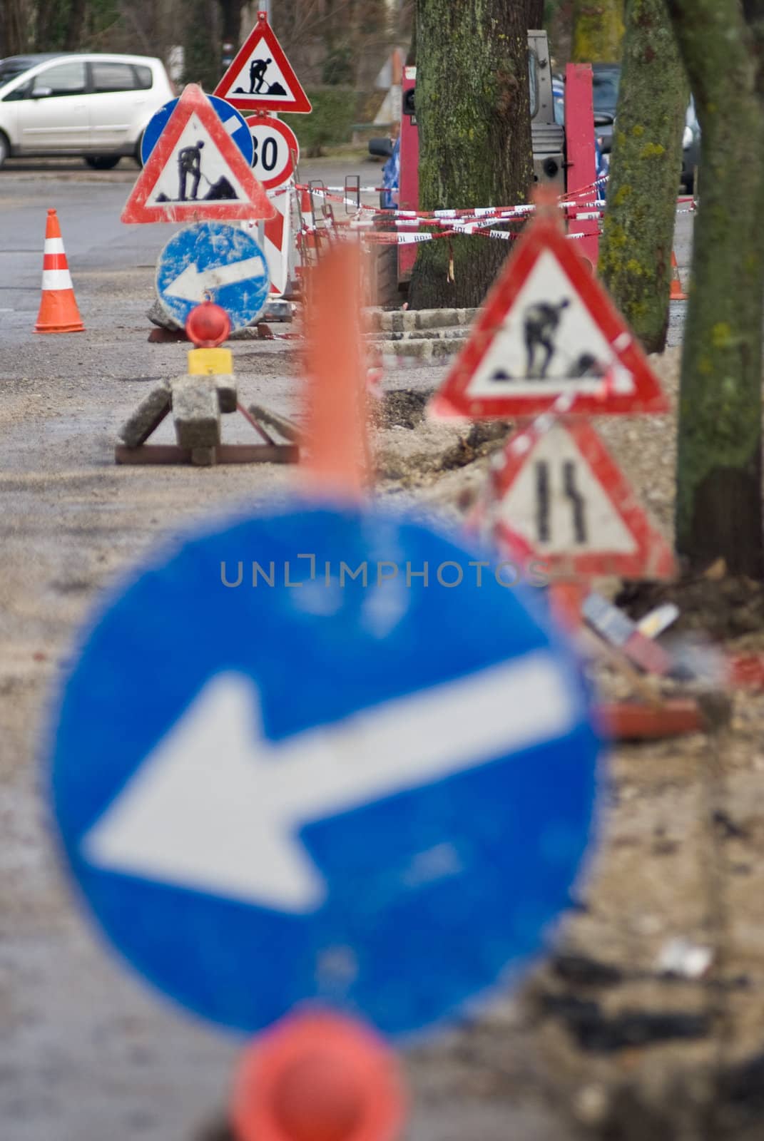 a construction site with a lot of street signs