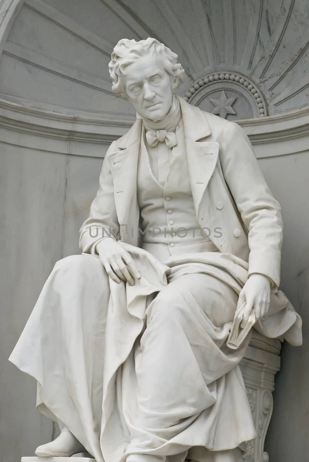 a sculpture of the famous austrian lyric poet franz grillparzer which is located in the vienna volksgarten