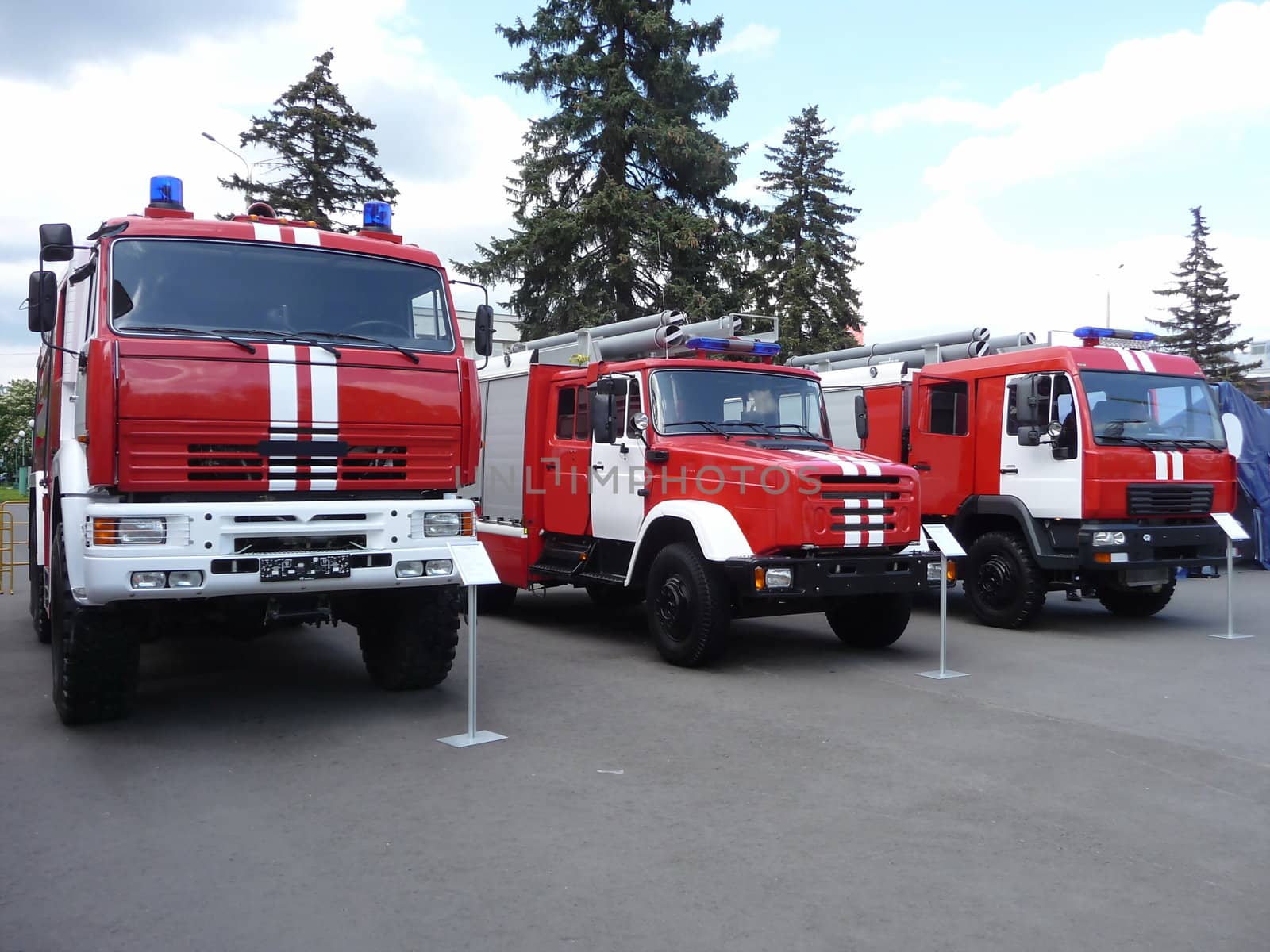 Line of red fire trucks at the exhibition