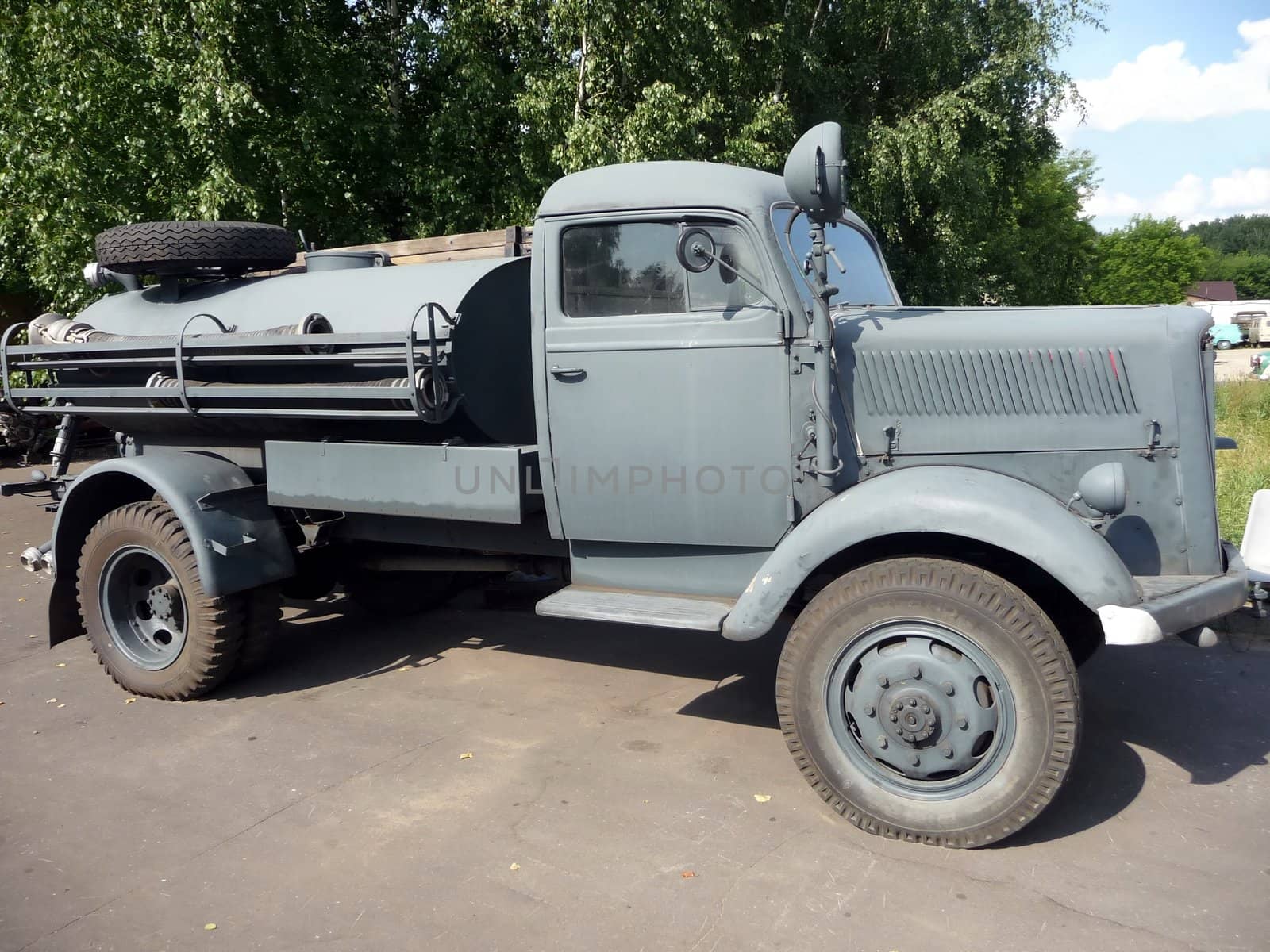 Old green sanitarian truck at the outdoor museum