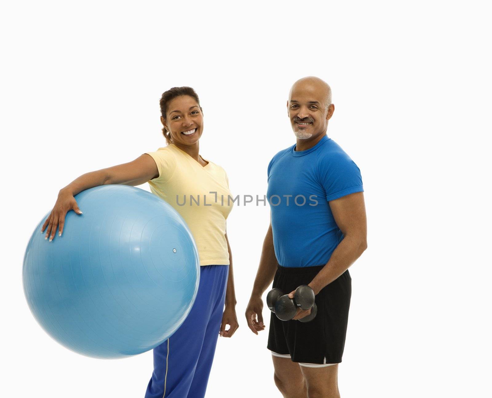 Man and woman exercising. by iofoto