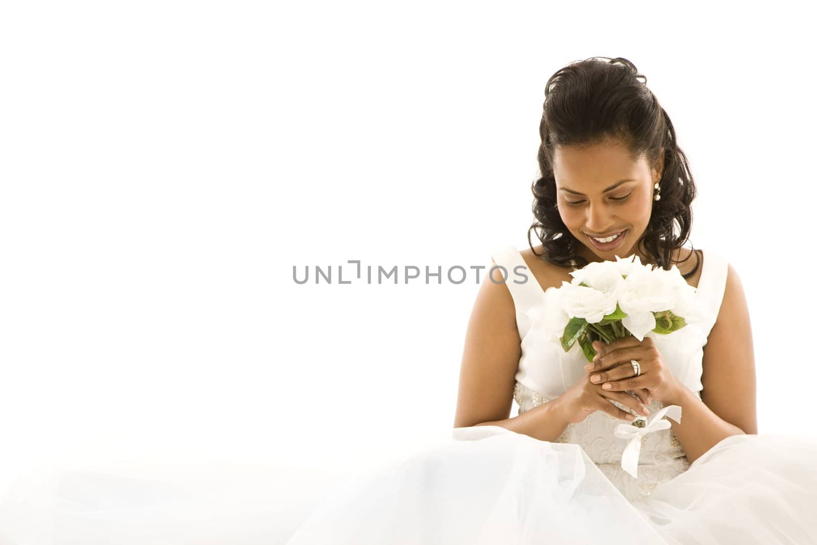 Mid-adult African-American bride on white background.