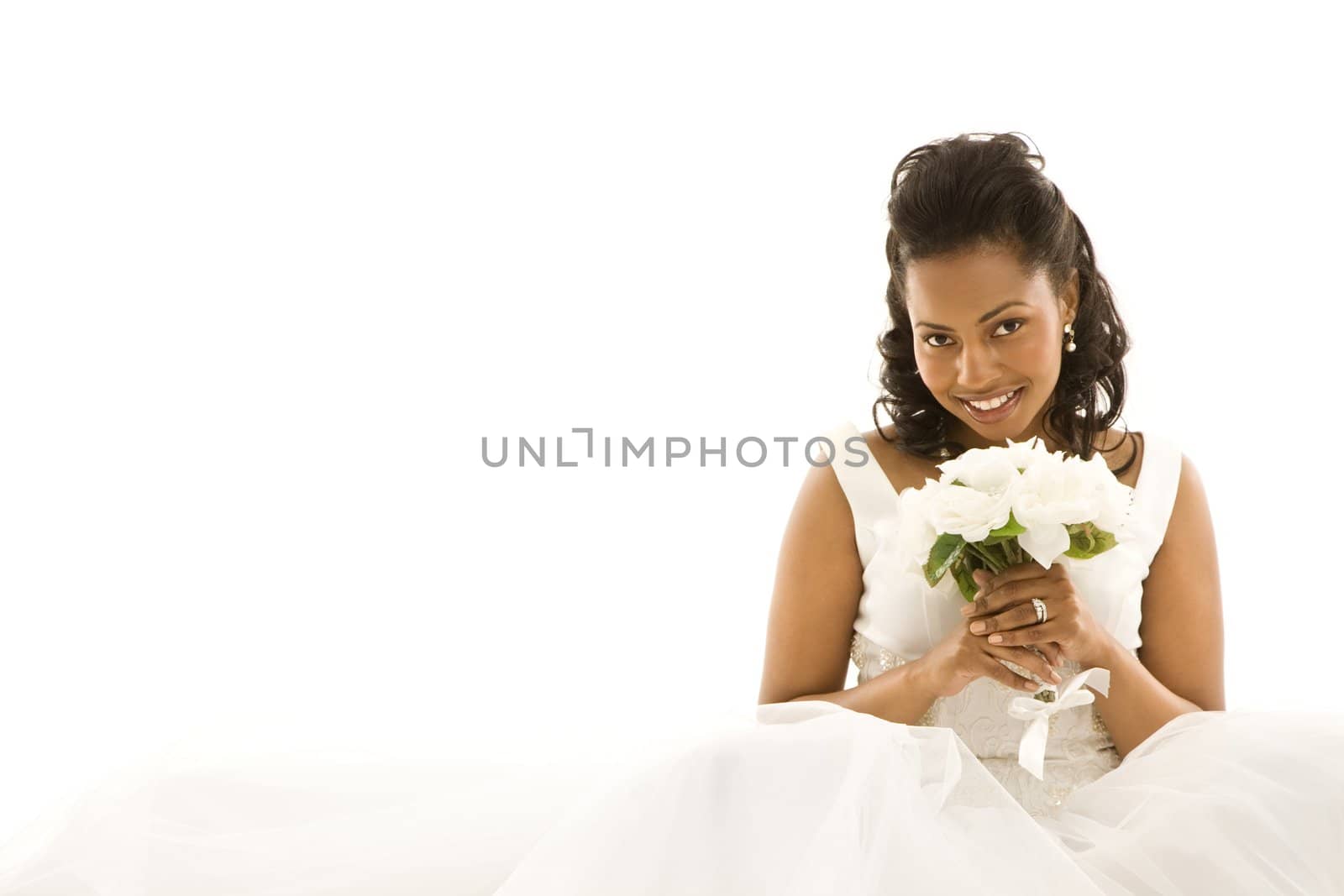 Mid-adult African-American bride on white background.