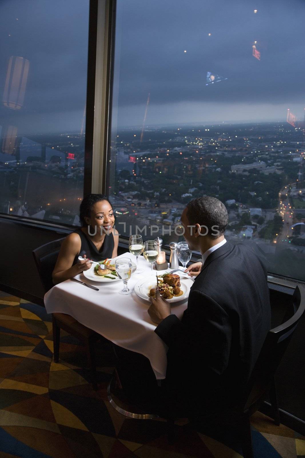 African-American couple having dinner at the Tower of the Americas in San Antonio, Texas.