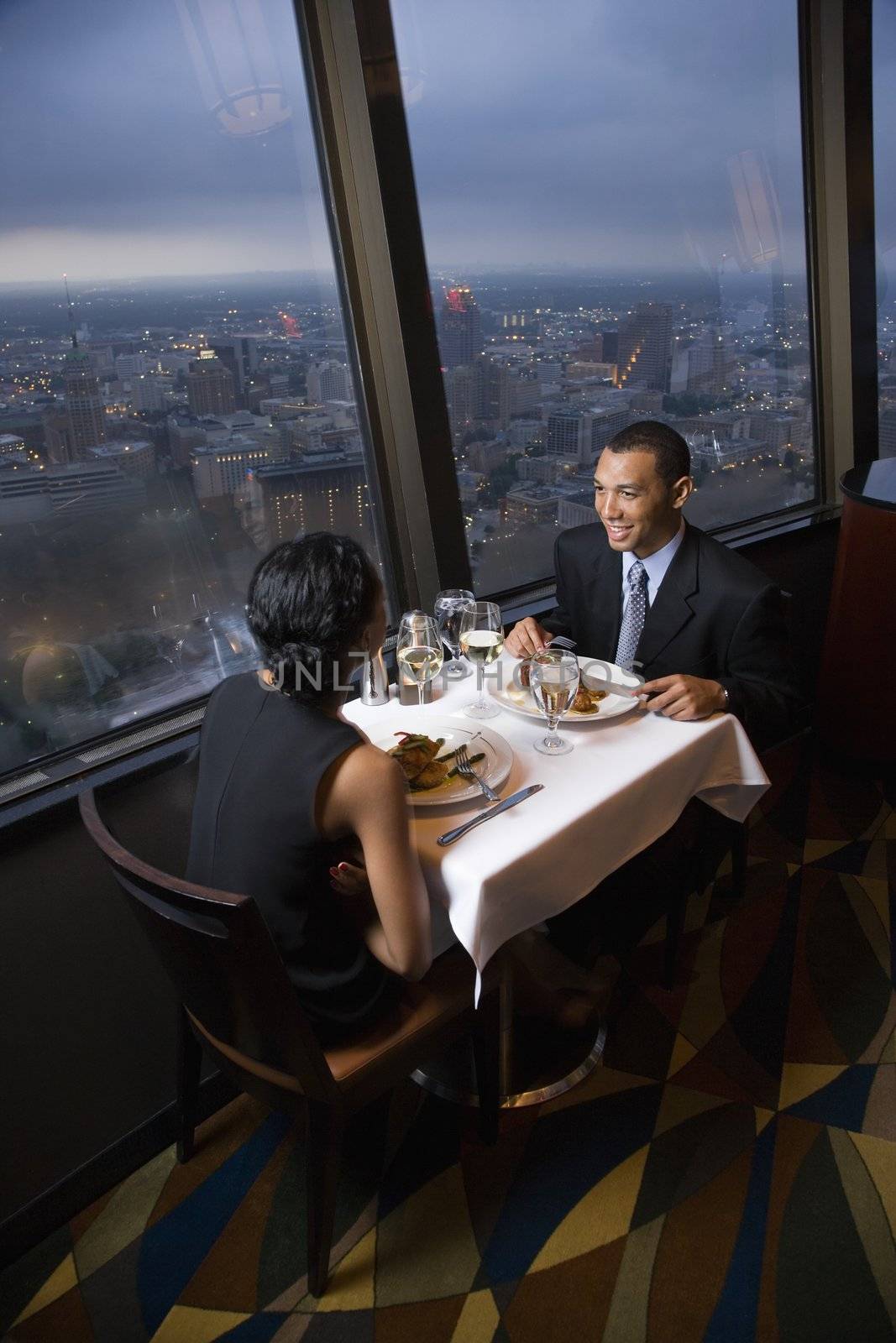 African-American couple having dinner at the Tower of the Americas in San Antonio, Texas.