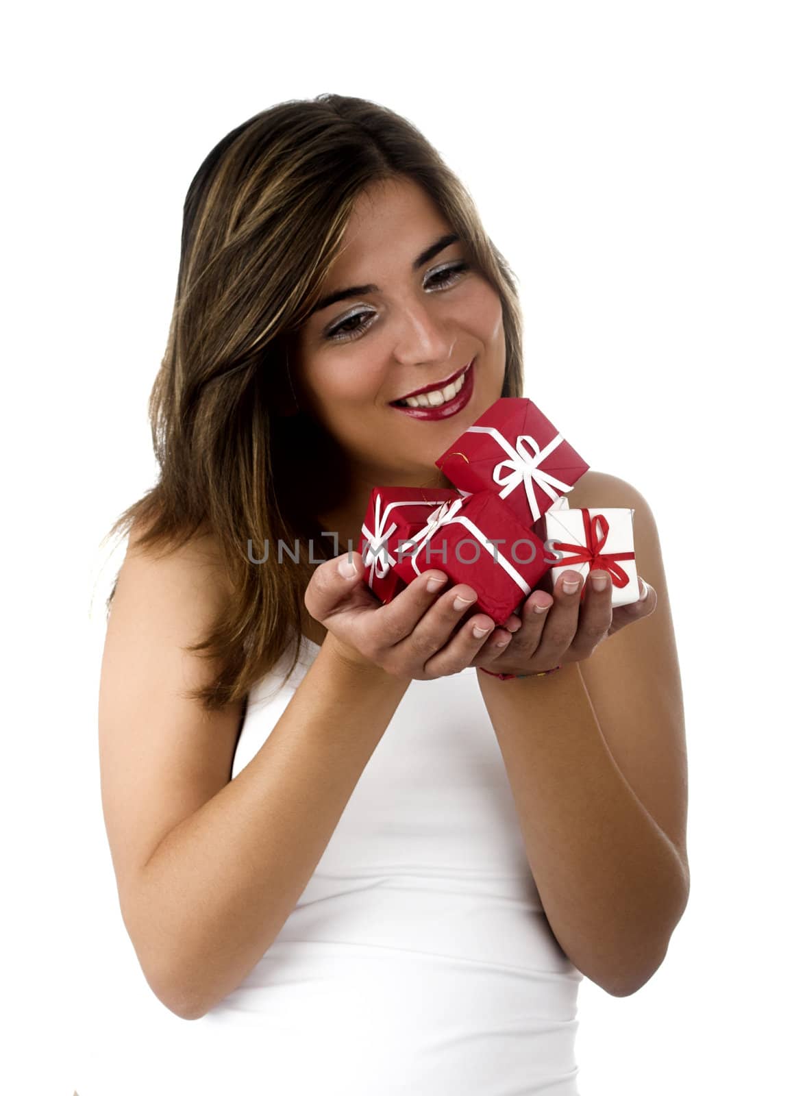 Christmas season! Different poses of a beautiful woman with small gifts on the hands.  (Focus is on the gifts)