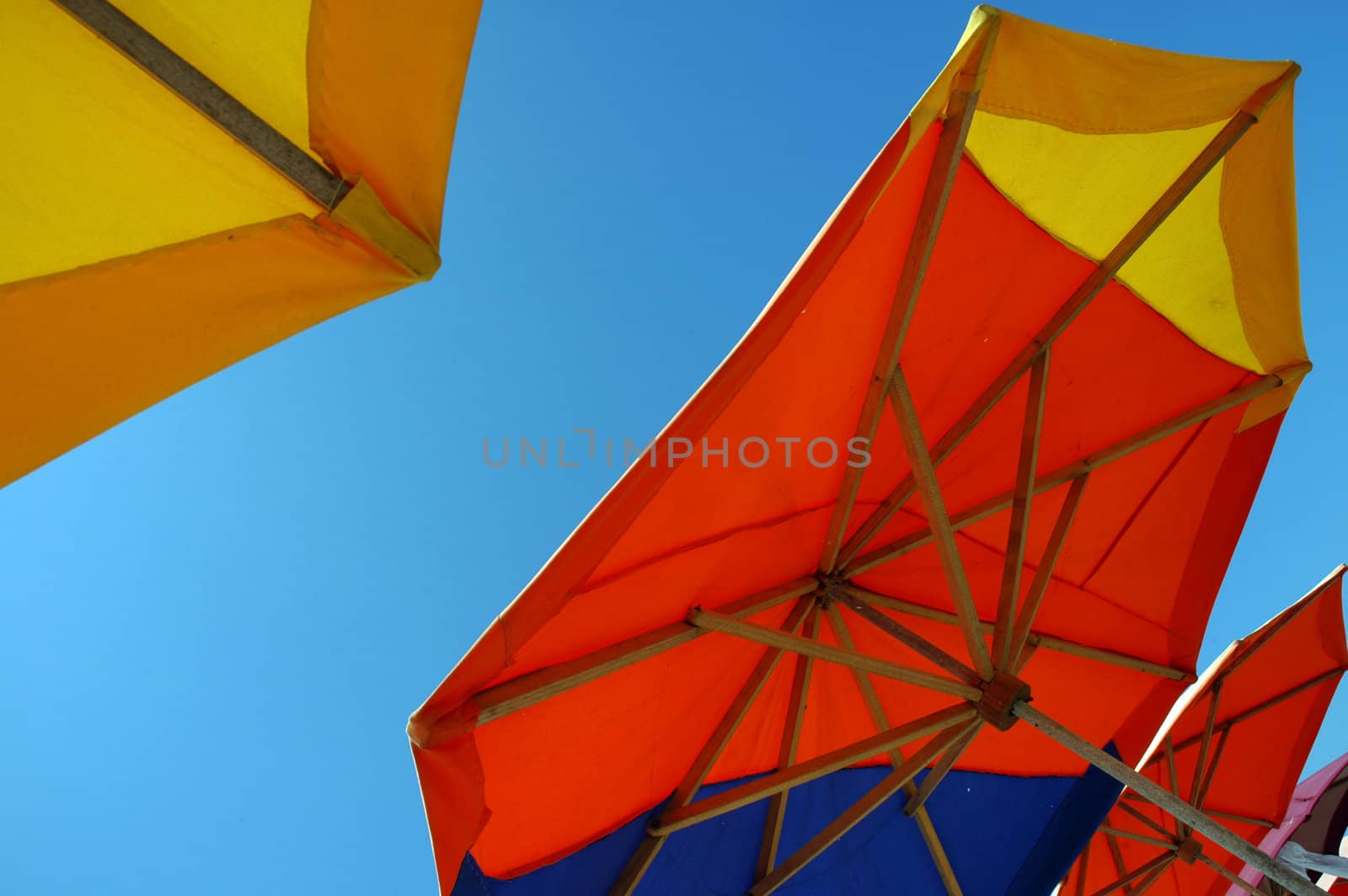 Colorful beach umbrellas by haak78