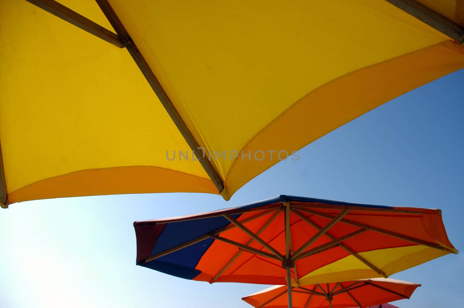 Colorful beach umbrellas by haak78