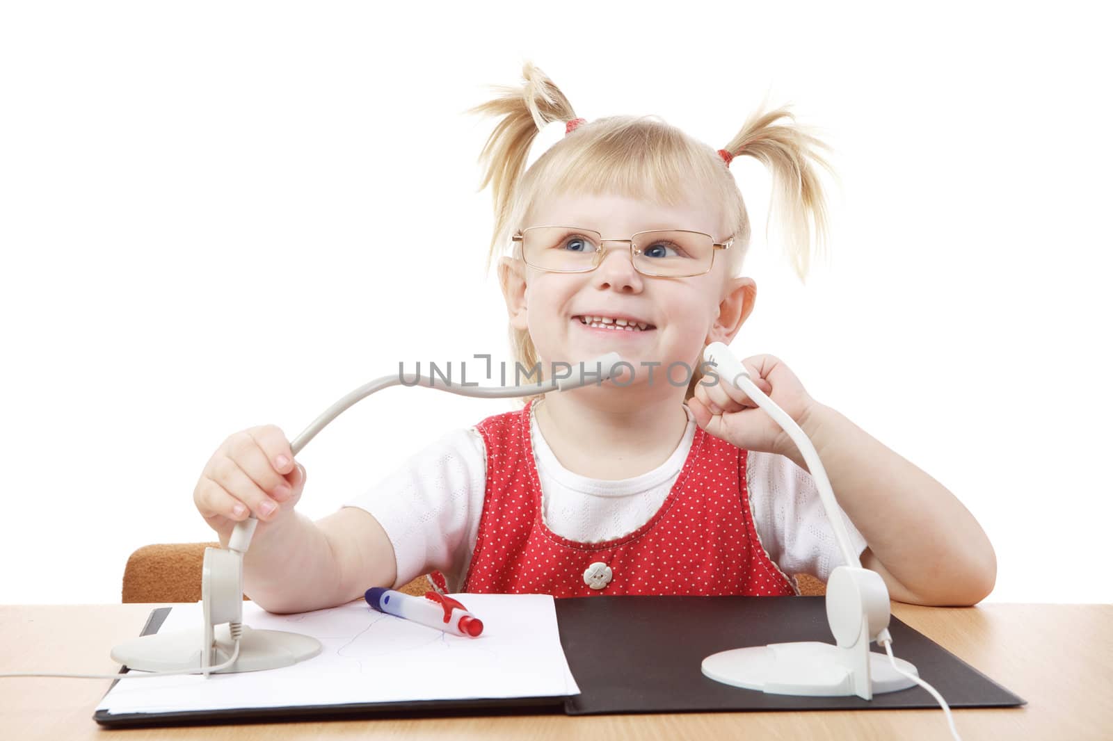 happy child at the table with microphones