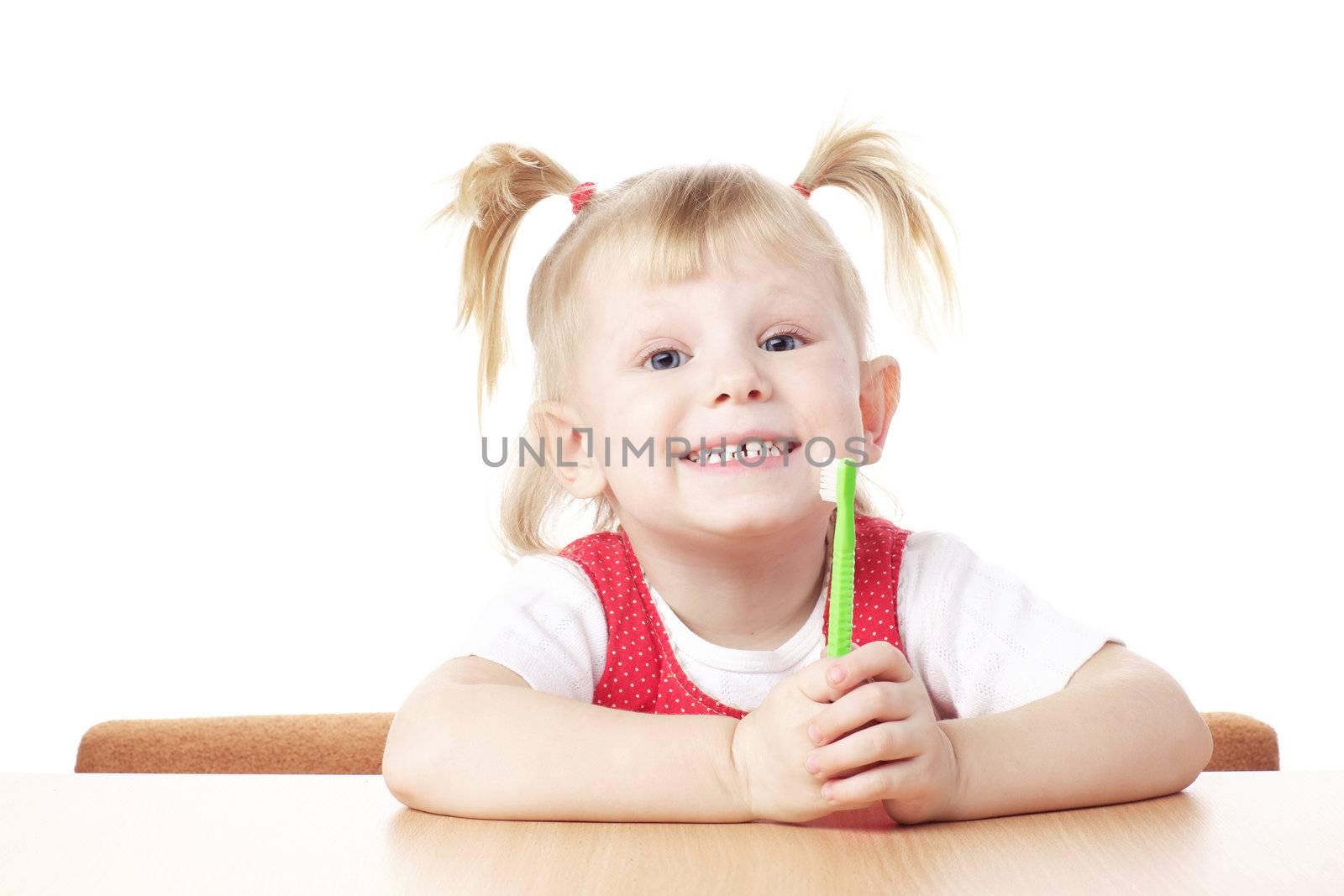 child with toothbrush in hands